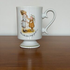 Holly Hobbie Porcelain Pedestal Coffee Mug -“Love Is The Little Things You Do”